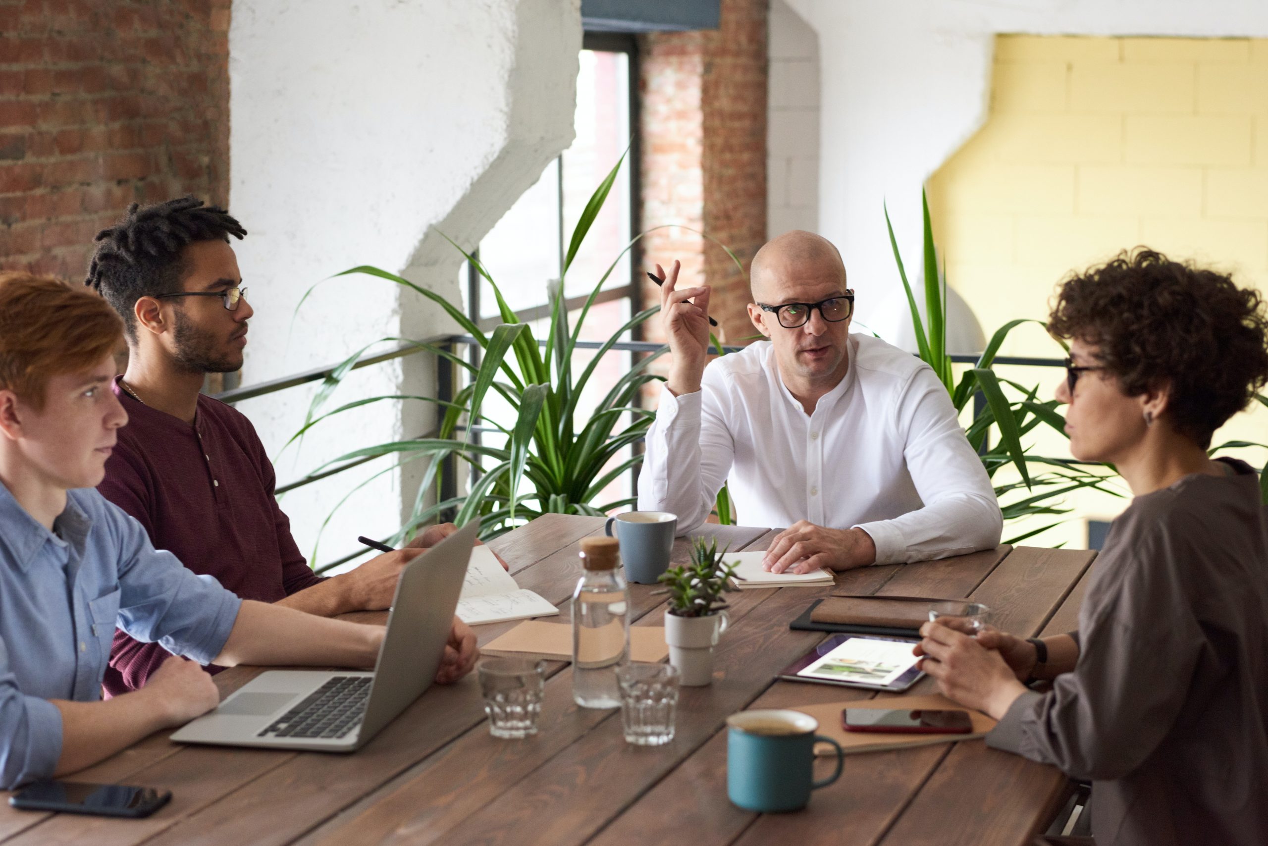 business owners meeting to discuss business advisory services